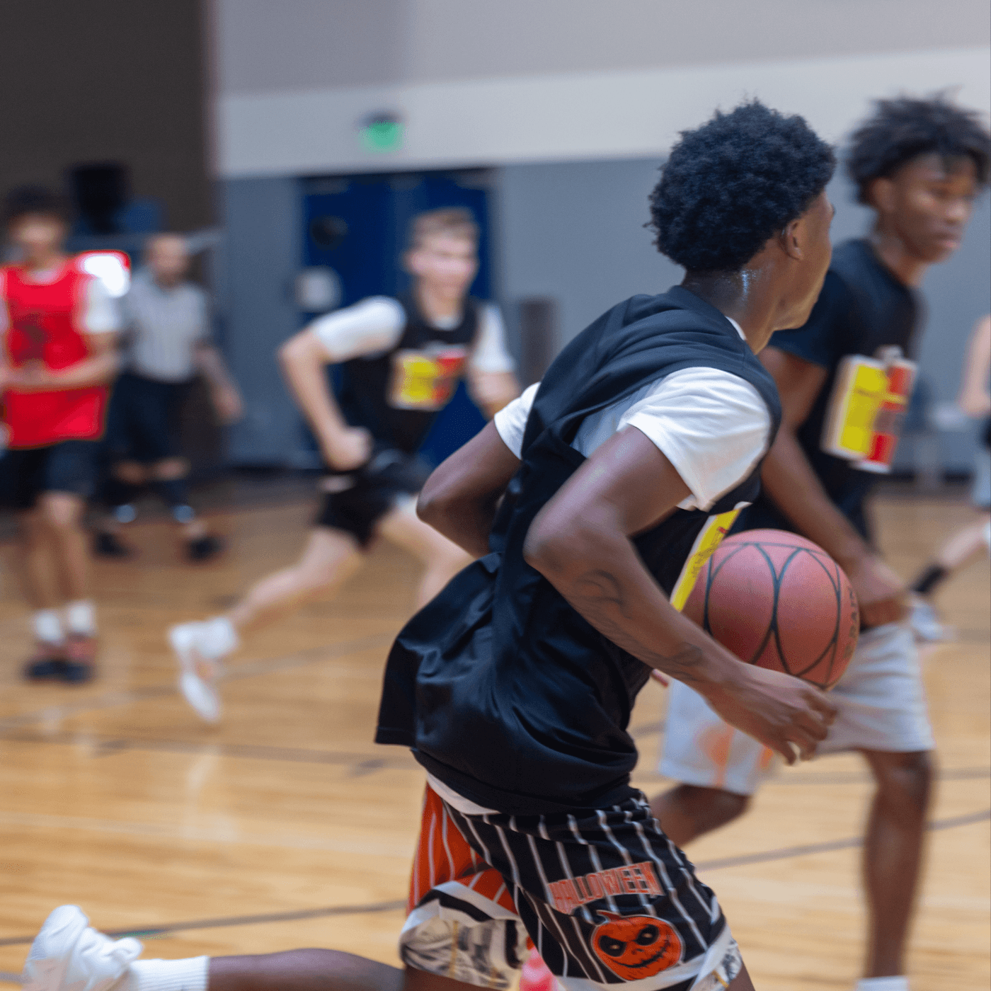 Athlete dribbling at speed in live No Backboard Basketball play