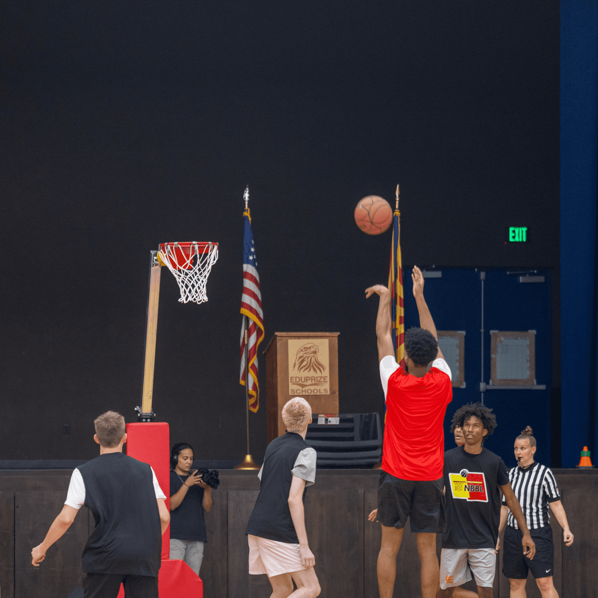 Player shooting at the UHoop during live No Backboard Basketball action